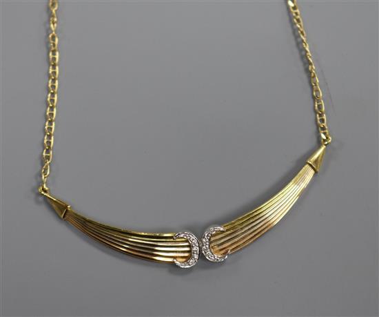 An 18ct three-colour gold pendant necklace incorporating two diamond-set crescents,